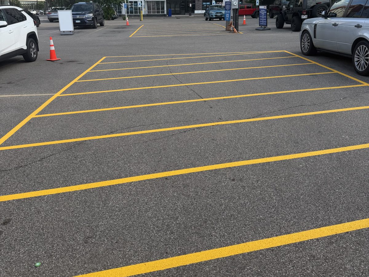 Yellow parking stalls restriped at an apartment lot in the Twin Cities by StripePro